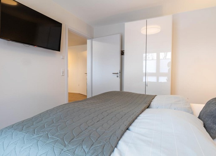 Ankerplatz - Deine Ferien - Schlafzimmer mit Smart-TV