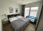 Ferienhaus Sonnenweg 40 - Kinderbett - Deine Ferien 