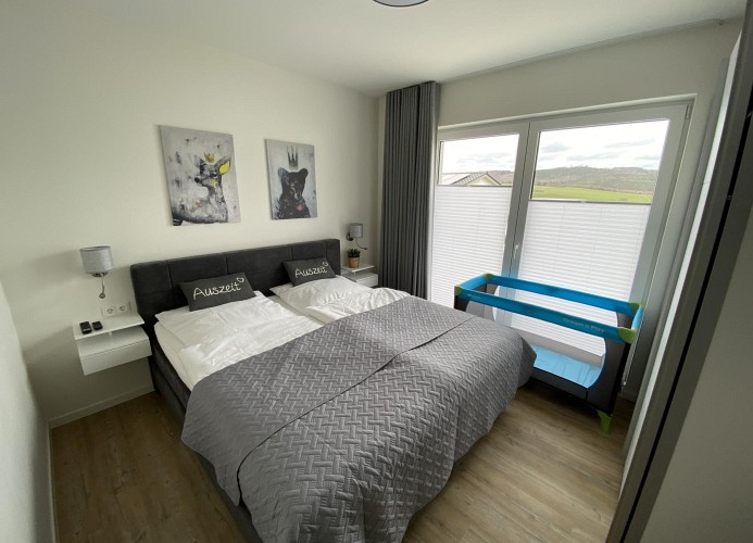 Ferienhaus Sonnenweg 40 - Kinderbett - Deine Ferien 