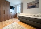 Villa Heimathafen Rügen - Deine Ferien - Schlafzimmer 3 im Untergeschoss mit Smart-TV