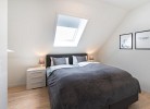 Ferienhaus Meeperle - Deine Ferien - Schlafzimmer 1 -  Boxspringbett